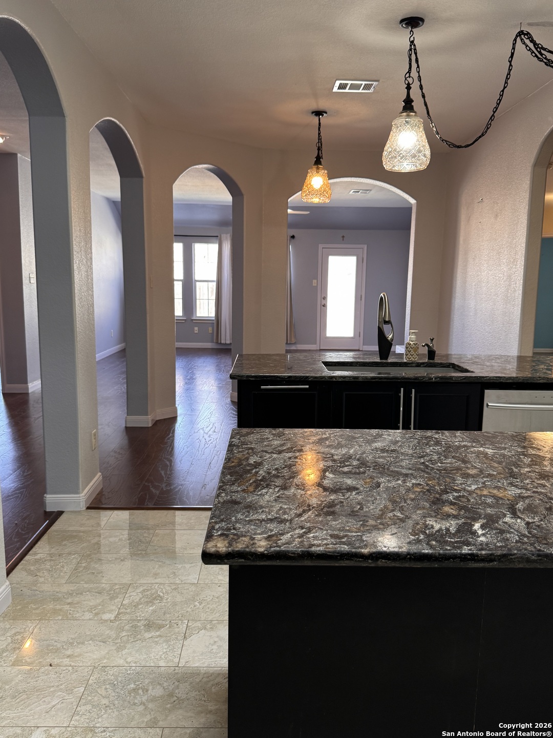 3836 Laurel Ridge Drive Round Rock, TX 78665 - Photo 7 of 40 a view of a kitchen center and living room