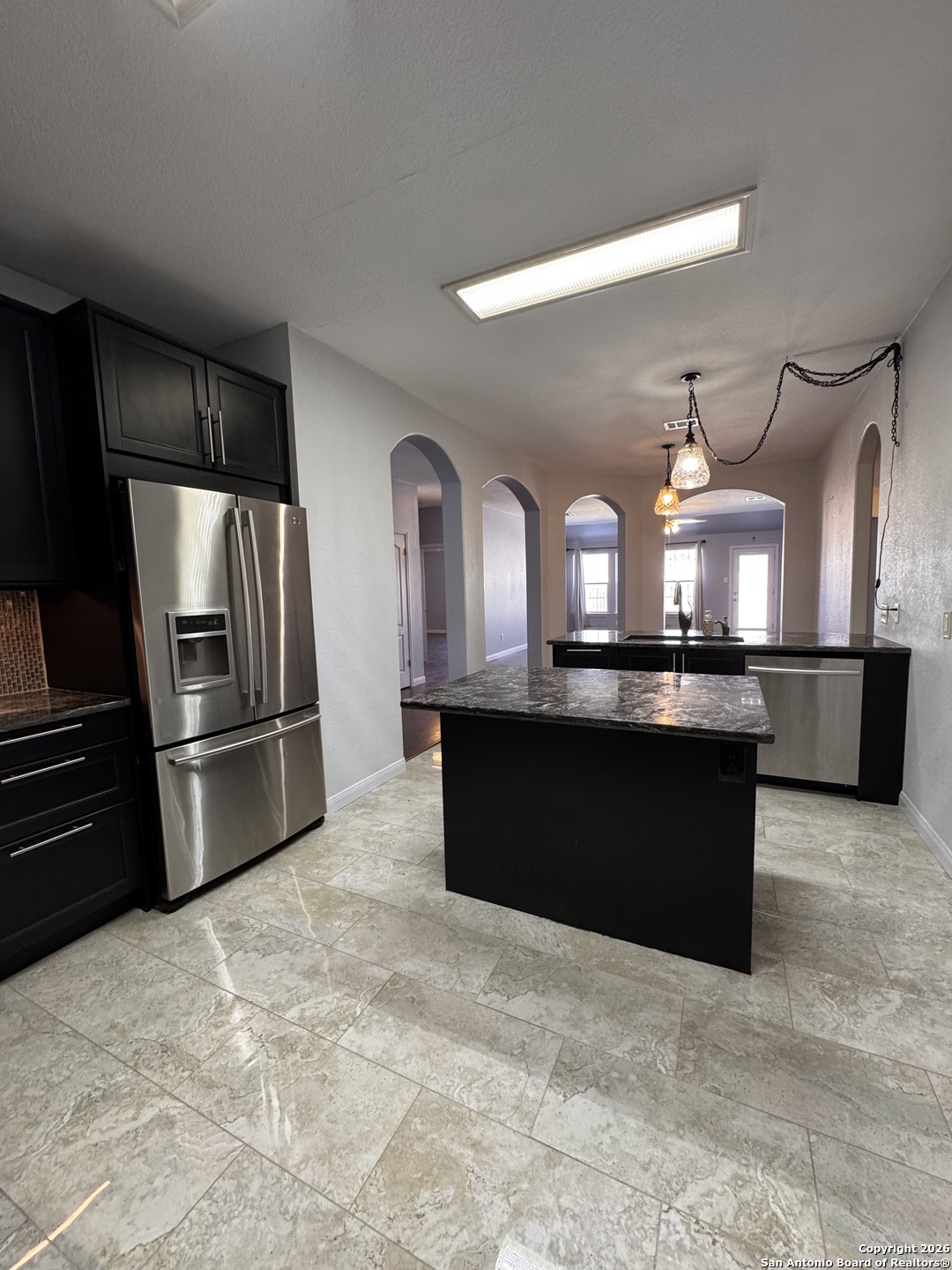 3836 Laurel Ridge Drive Round Rock, TX 78665 - Photo 8 of 40 a kitchen with a refrigerator and a sink