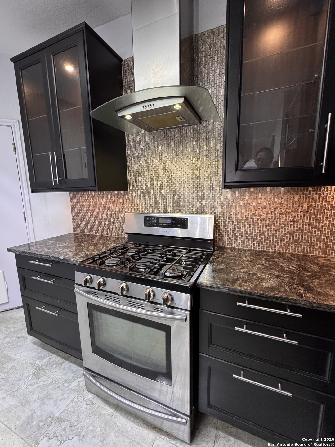 3836 Laurel Ridge Drive Round Rock, TX 78665 - Photo 10 of 40 a stove top oven sitting inside of a kitchen