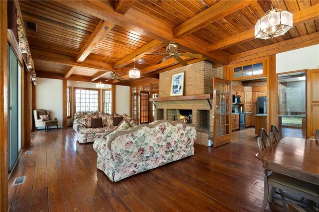 a living room with fireplace furniture and a flat screen tv