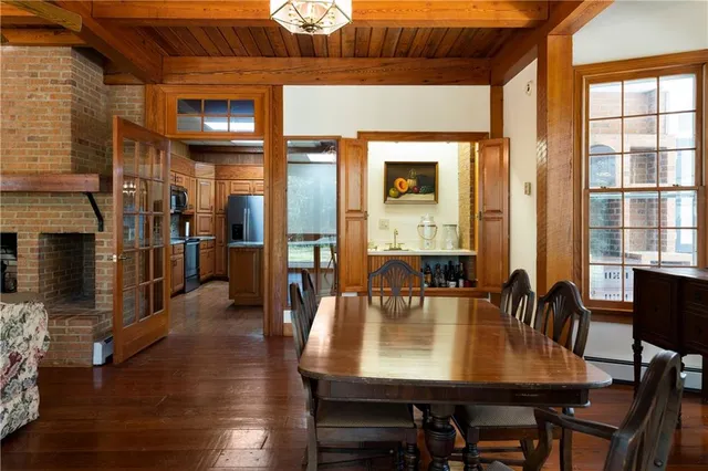 a kitchen with stainless steel appliances granite countertop a refrigerator a sink and a stove