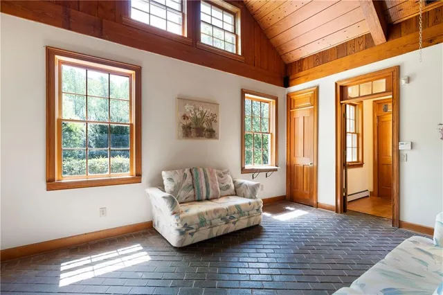 a view of a house with backyard sitting area and garden