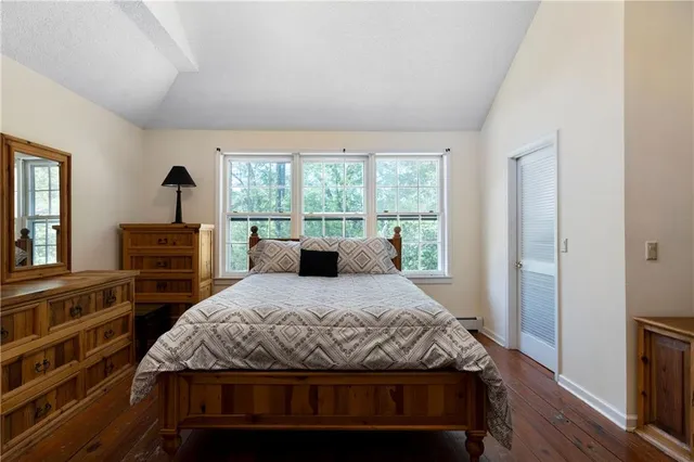 an aerial view of a house with yard and outdoor seating