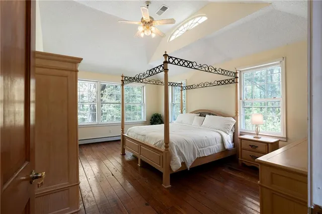 an aerial view of residential houses with outdoor and green space
