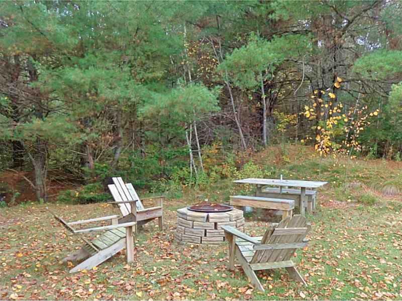 4 Getchell Road Clifton, ME 04428 - Photo 6 of 19 Yard/Garden. Back yard fire pit and...
