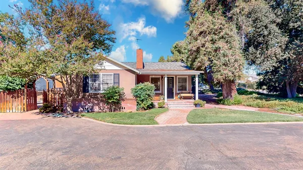 a house with trees in the background