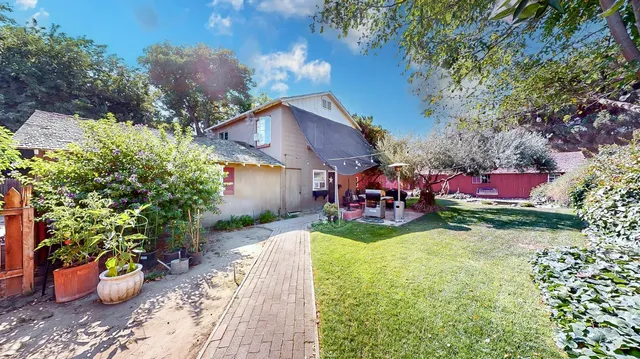 a view of swimming pool with a yard