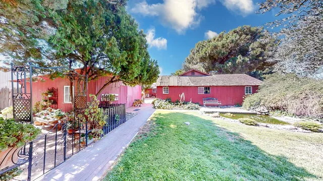 a view of a backyard of the house