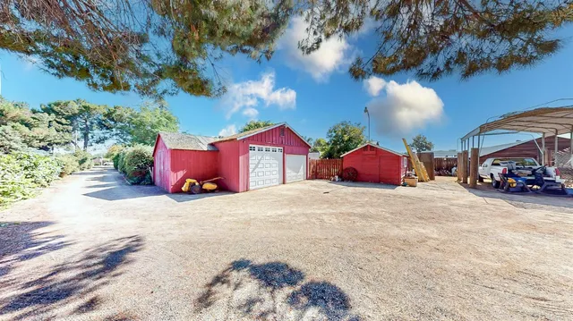 a kitchen with a stove cabinets and wooden floor