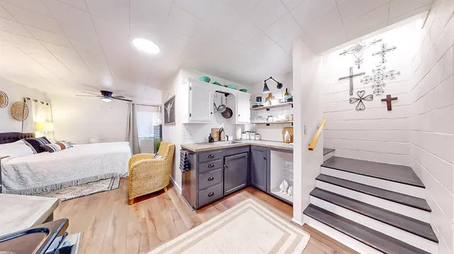 a bathroom with a sink a vanity and a mirror