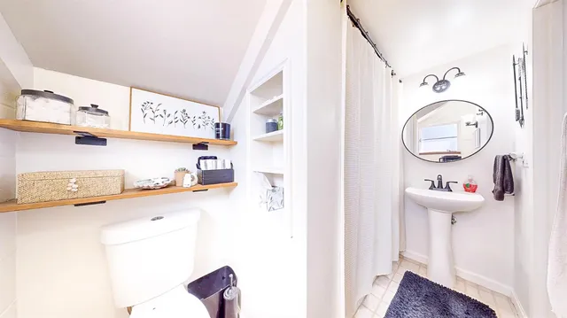 a work room with furniture and a window