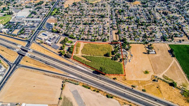 an aerial view of a residential houses with outdoor space