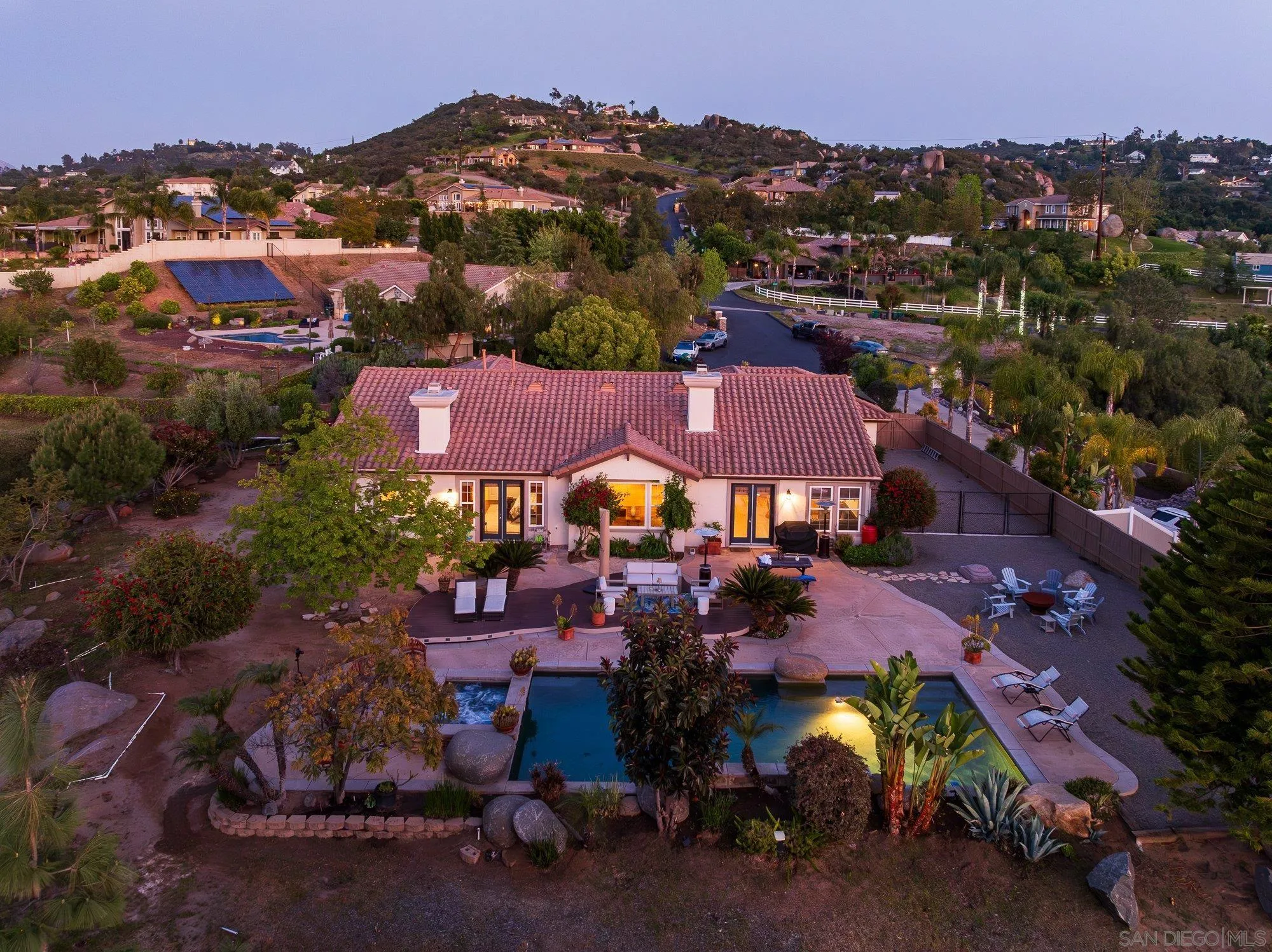 an aerial view of a houses with a city street