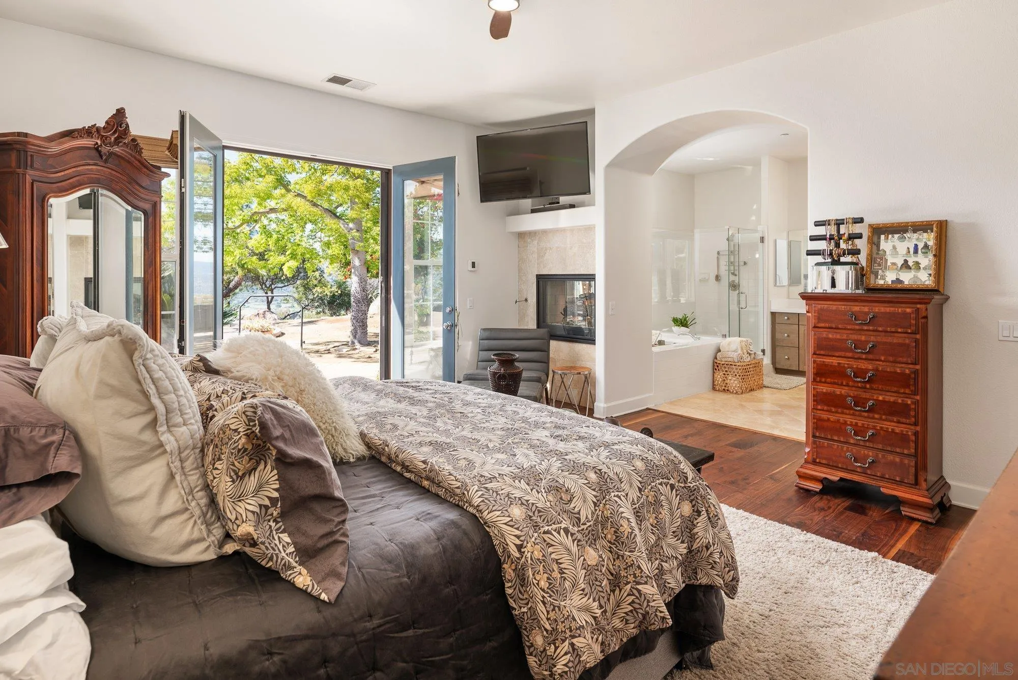 424 Sky Mesa Road Alpine, CA 91901 - Photo 34 of 75 a bedroom with a bed and dresser with mirror