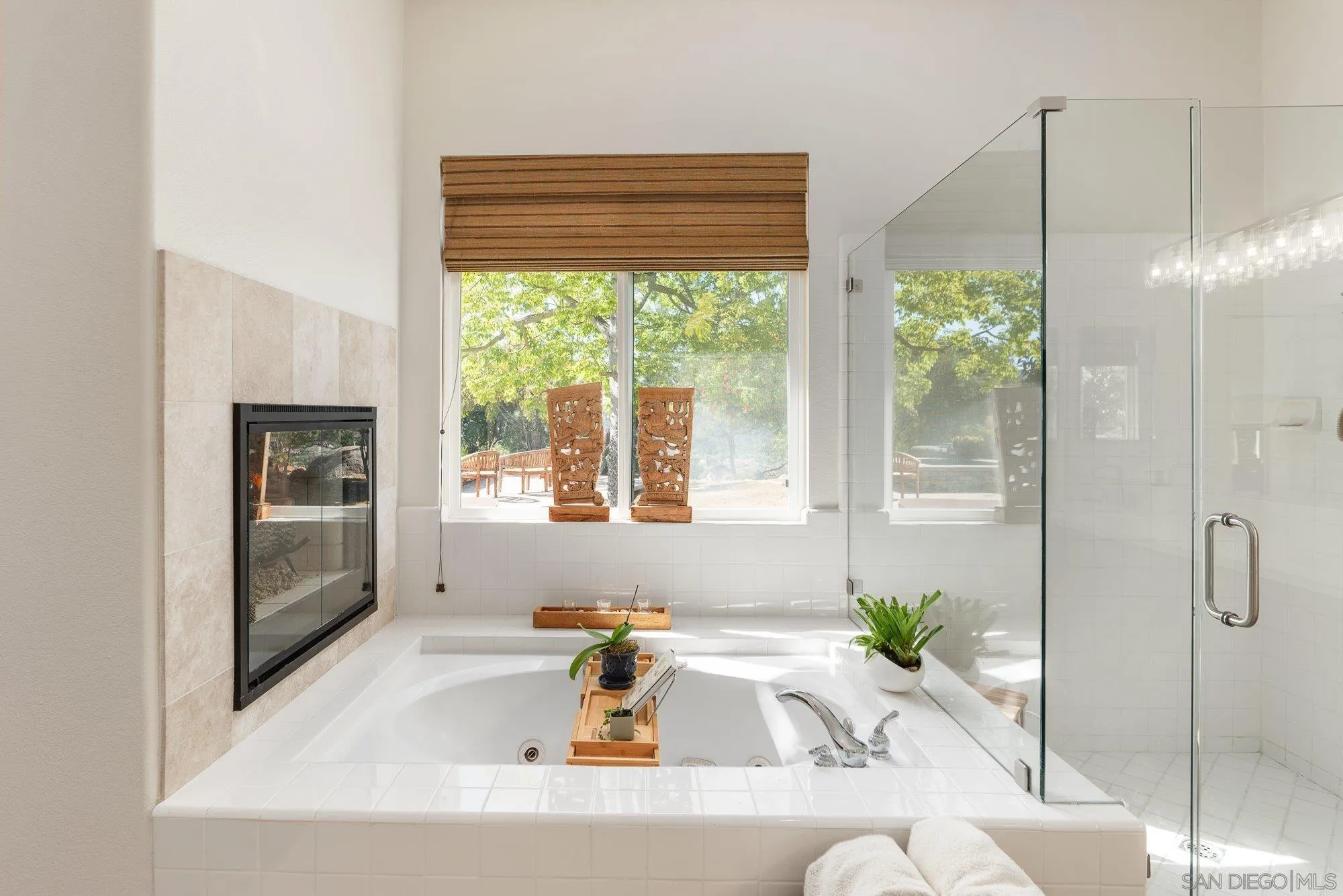 424 Sky Mesa Road Alpine, CA 91901 - Photo 37 of 75 a white bath tub sitting in a bathroom next to a window