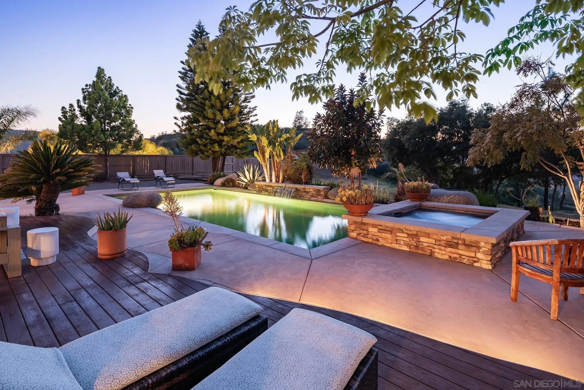 424 Sky Mesa Road Alpine, CA 91901 - Photo 54 of 75 a view of a patio with couches table and chairs with wooden floor and fence