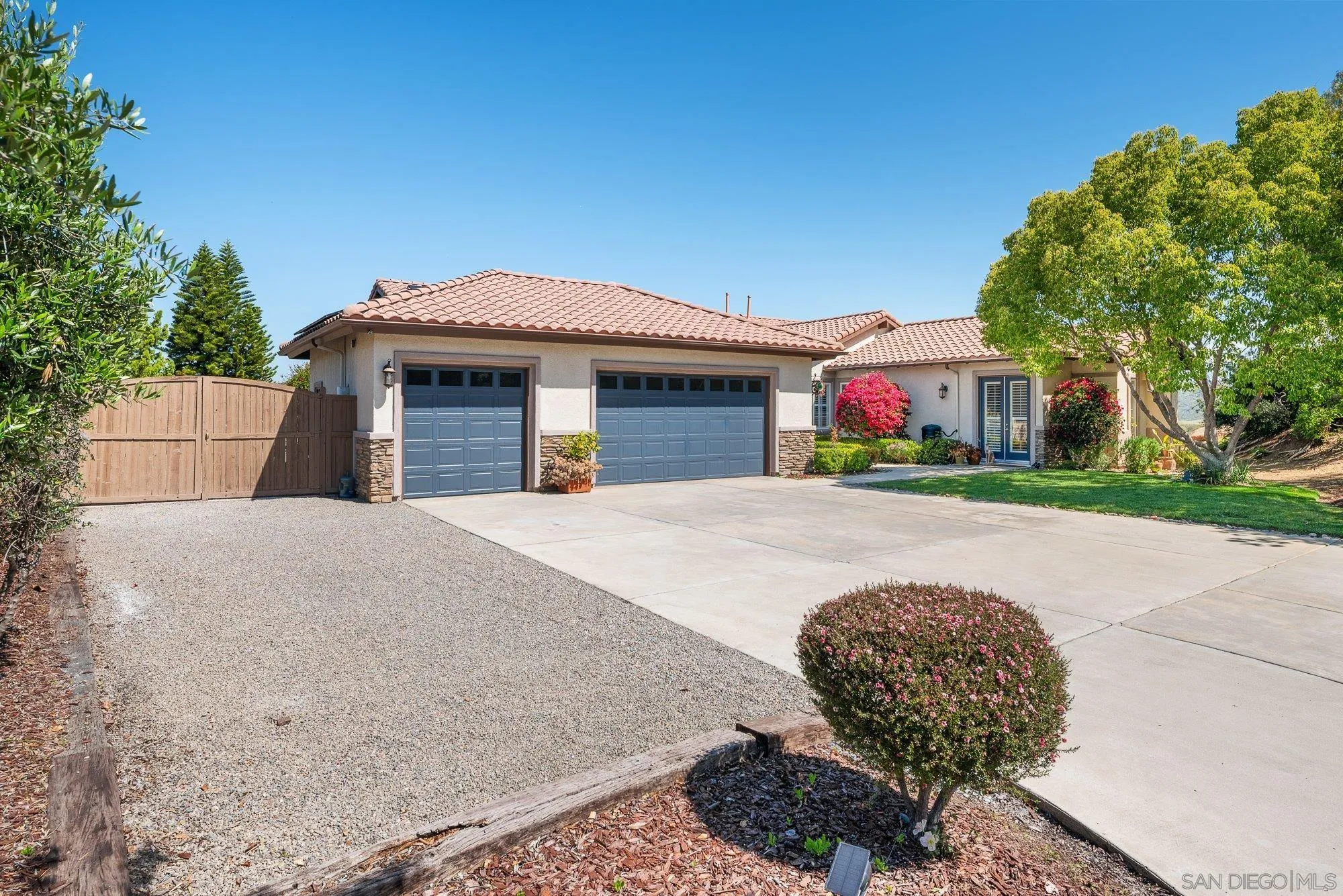 424 Sky Mesa Road Alpine, CA 91901 - Photo 6 of 75 a view of a white house with a big yard plants and large trees