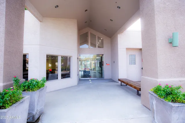 a view of a house with swimming pool and sitting area
