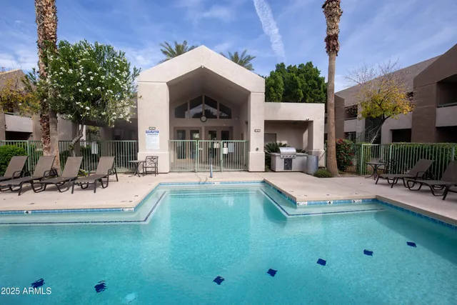 a view of a backyard with sitting area