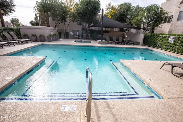 a room with pool table and windows