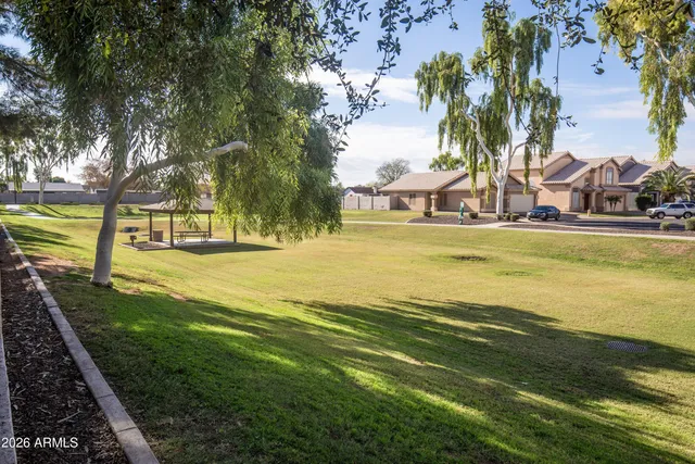 a swimming pool with lawn chairs
