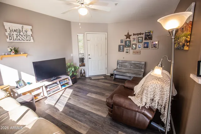 a living room with furniture and a large window