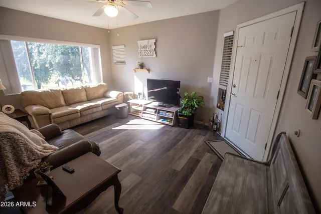 a living room with furniture and a large window