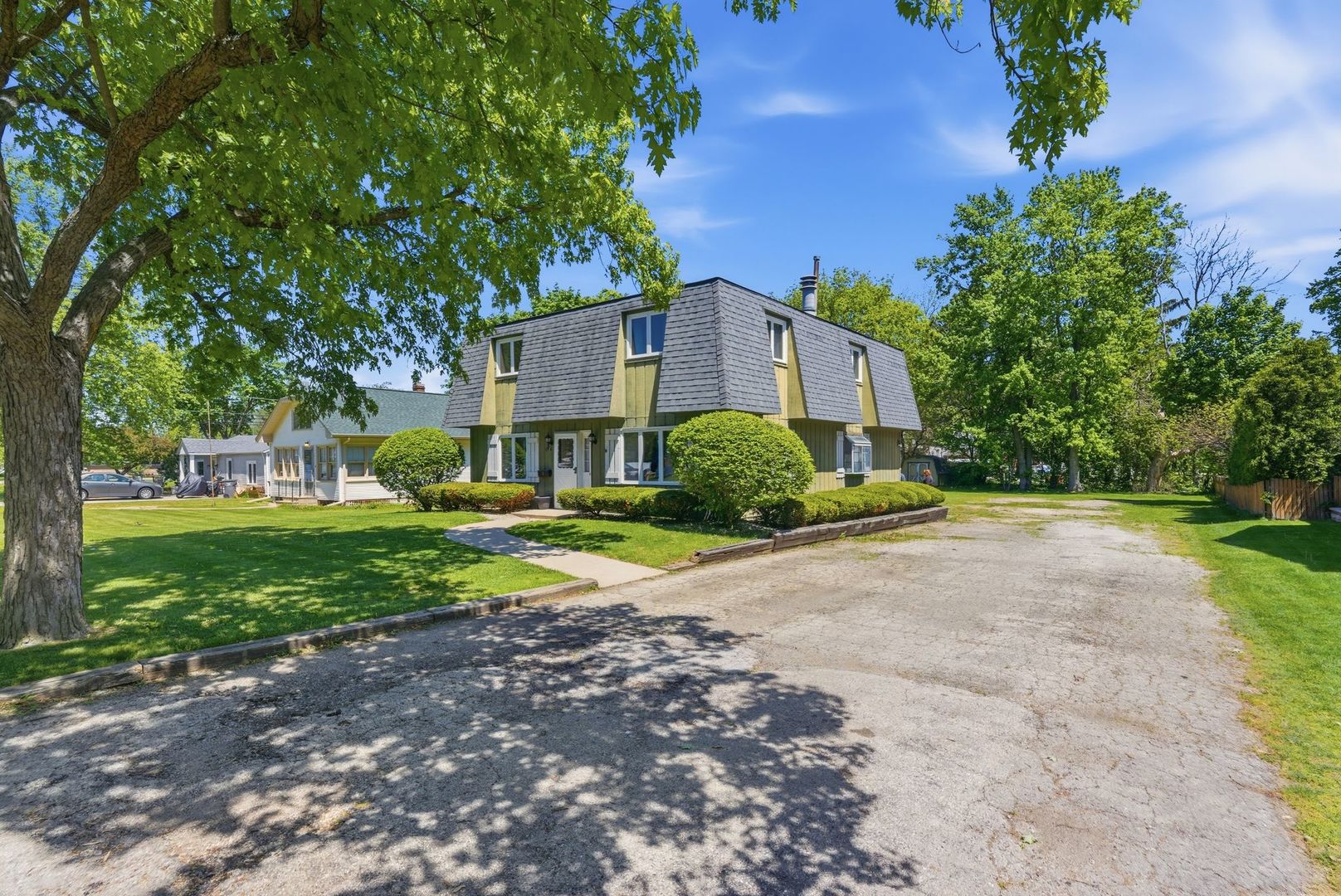 1356 Fifth Street Montgomery, IL 60538 - Photo 2 of 32 a view of a house with a yard and large trees