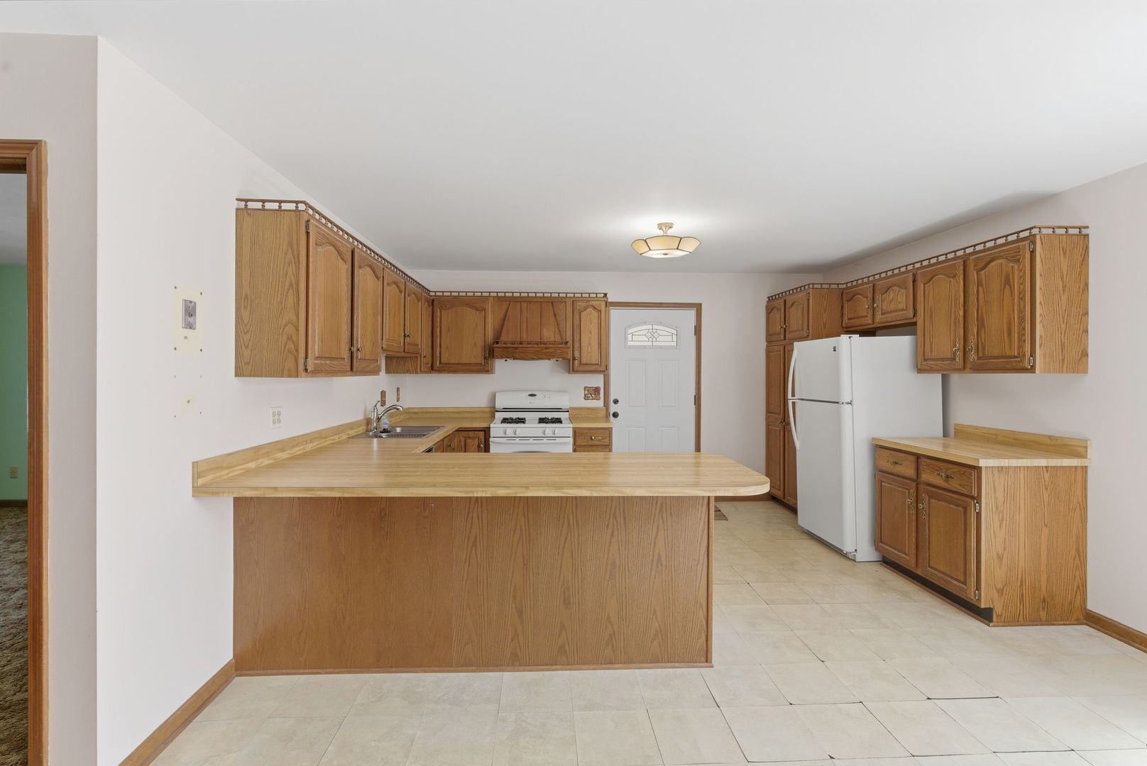 1356 Fifth Street Montgomery, IL 60538 - Photo 6 of 32 a view of a kitchen with sink and stove