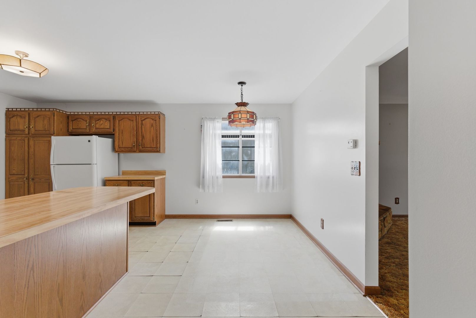 1356 Fifth Street Montgomery, IL 60538 - Photo 9 of 32 a view of a kitchen with a sink dishwasher and a refrigerator