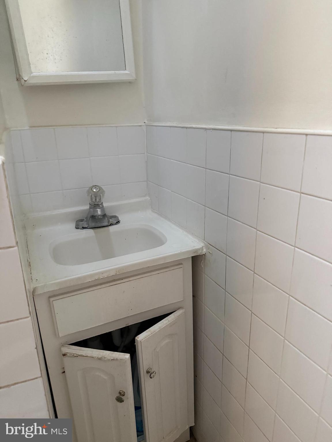 411 Timberlake Road Upper Darby, PA 19082 - Photo 10 of 15 a bathroom with a sink and vanity