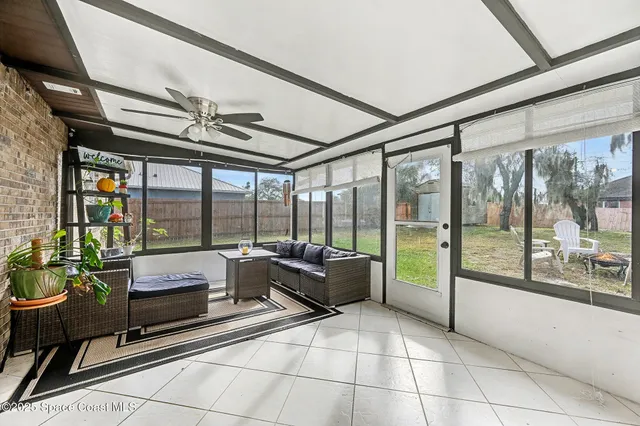 a lobby with furniture and floor to ceiling window