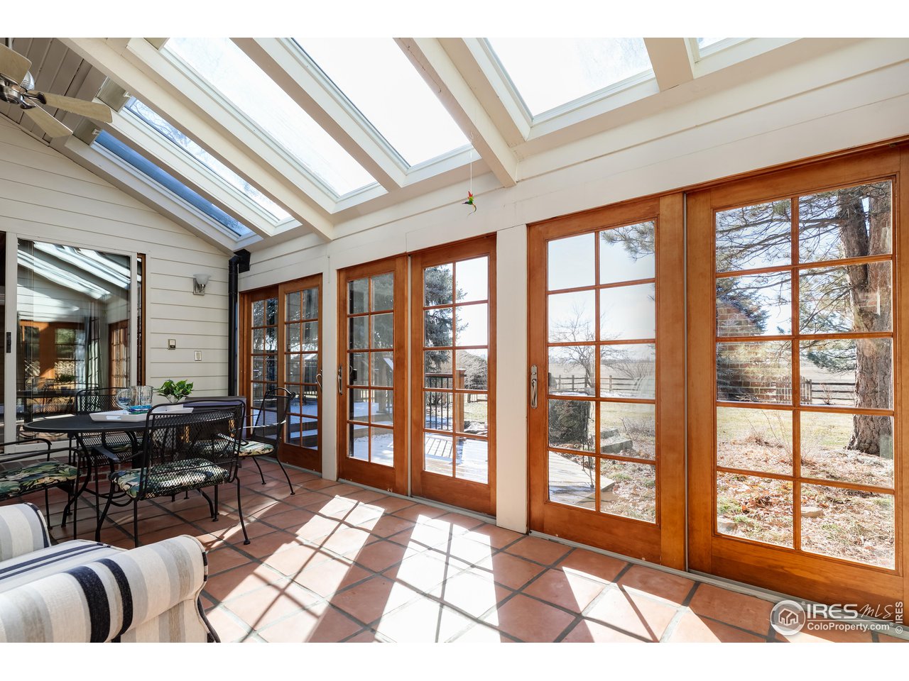 6142 Old Brompton Road Boulder, CO 80301 - Photo 17 of 30 Lots of sunlight in the sunroom!