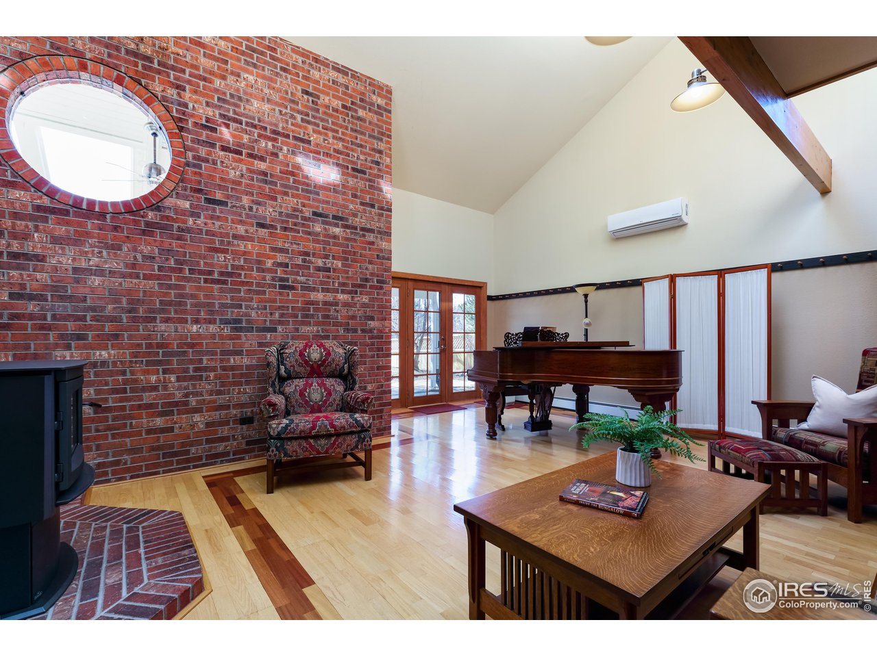 6142 Old Brompton Road Boulder, CO 80301 - Photo 7 of 30 Natural brick wall and lots of light in the living room