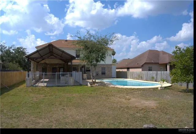 a view of a house with a yard porch and sitting area