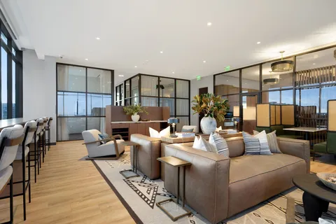 a living room with fireplace furniture and a wooden floor