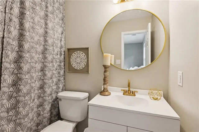 a bathroom with a toilet and a sink