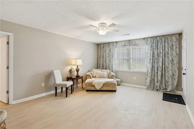 a bed room with a bed and a chandelier