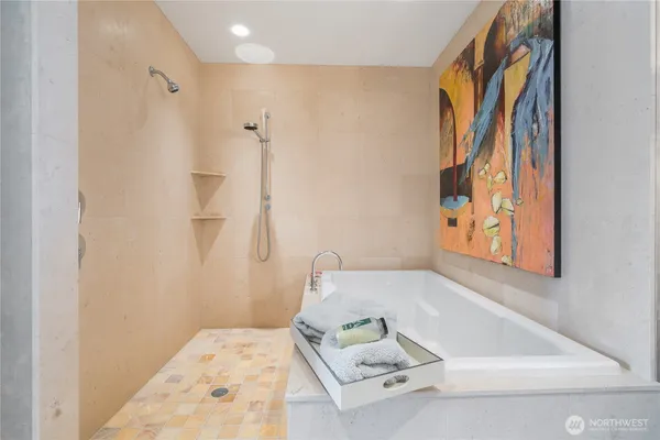 a en suite bathroom with a granite countertop sink and a mirror