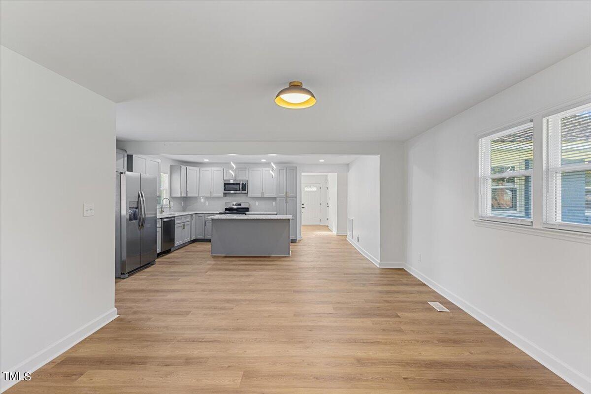808 Edison Road Raleigh, NC 27610 - Photo 3 of 24 a view of kitchen with wooden floor
