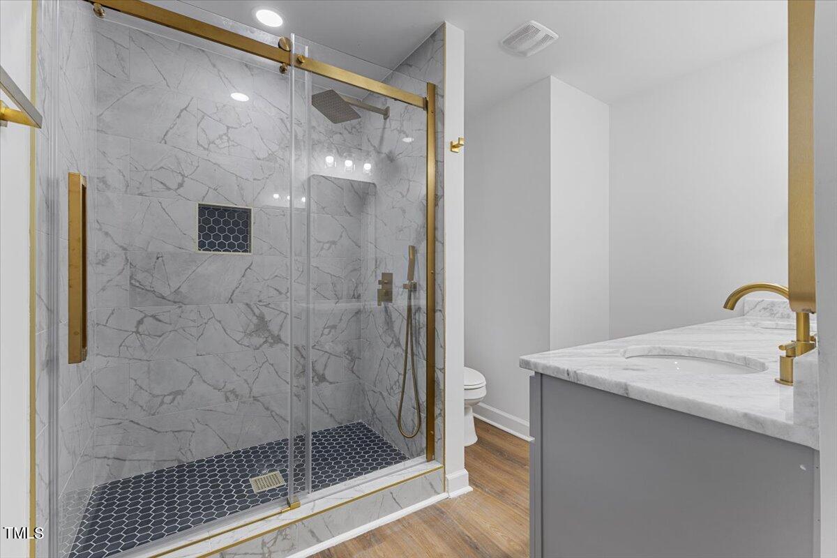 808 Edison Road Raleigh, NC 27610 - Photo 8 of 24 a bathroom with a shower and a sink