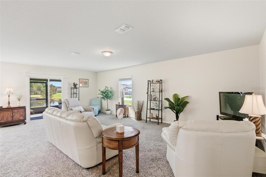 2 Pinnacle Place Bunnell, FL 32110 - Photo 21 of 83 a living room with furniture and a flat screen tv