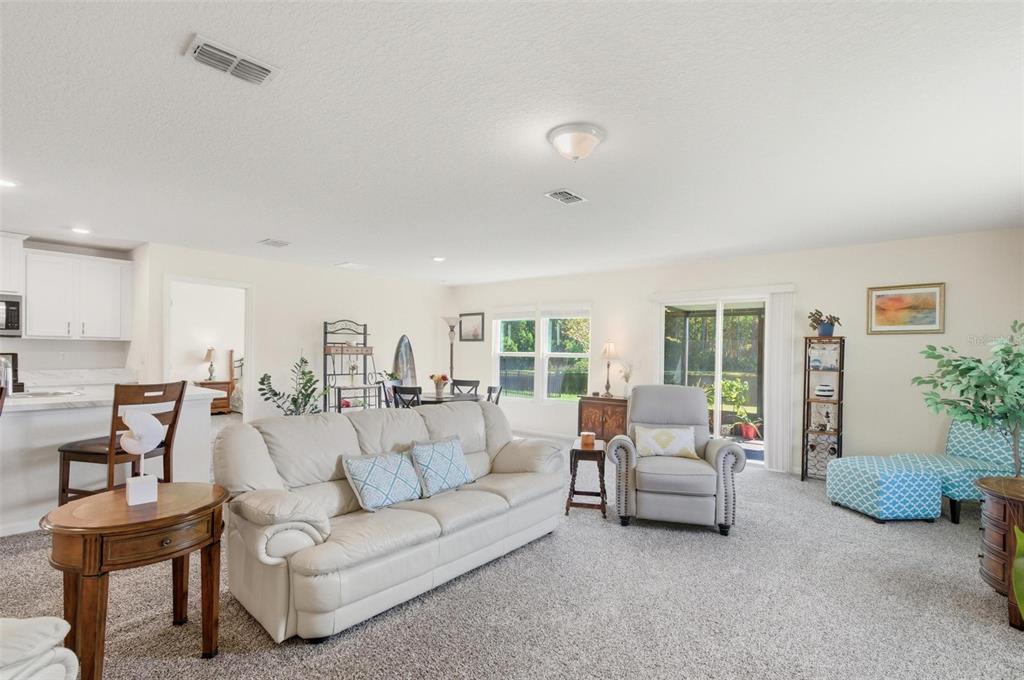2 Pinnacle Place Bunnell, FL 32110 - Photo 23 of 83 a living room with furniture and a large window