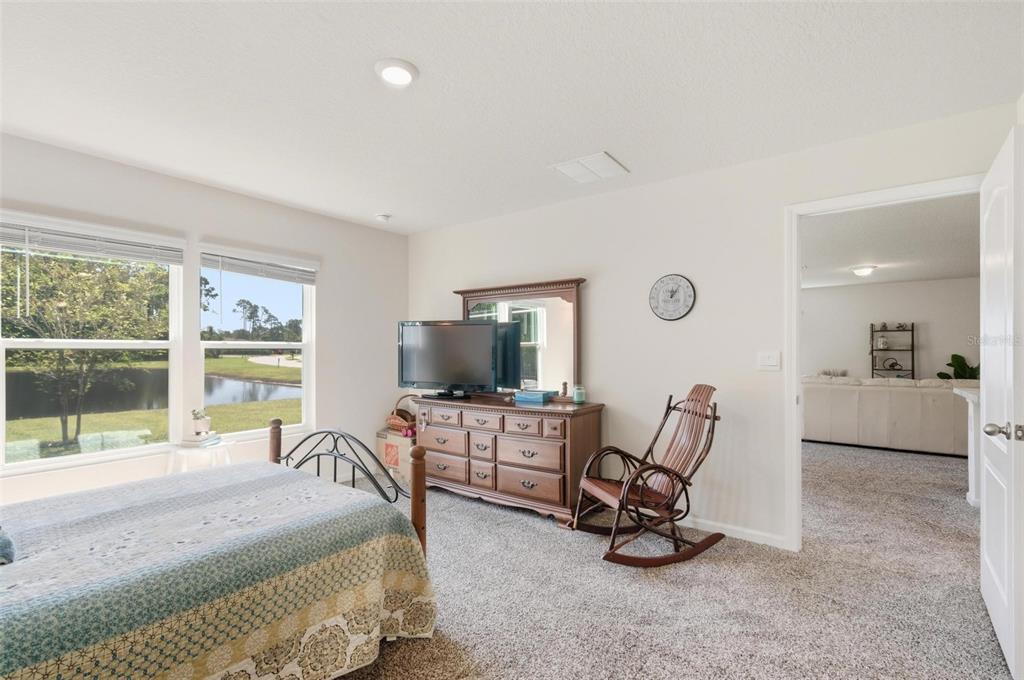 2 Pinnacle Place Bunnell, FL 32110 - Photo 30 of 83 a bedroom with furniture and a flat screen tv