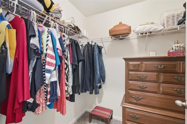 a view of a lake with a yard and outdoor seating