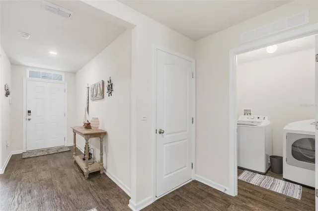 an aerial view of a house with a garden potted plants and large trees