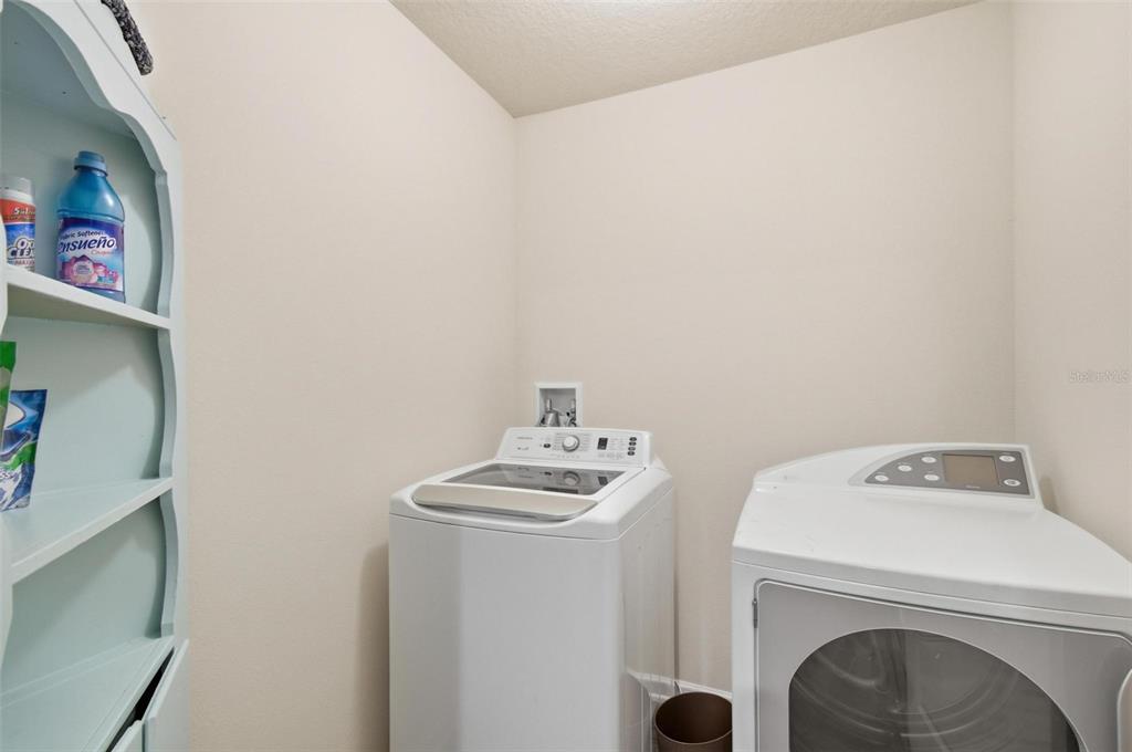 2 Pinnacle Place Bunnell, FL 32110 - Photo 42 of 83 a bathroom with a sink and a washer dryer