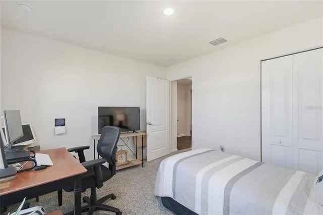 a living room with lots of furniture and a chandelier
