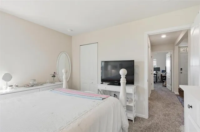 a living room with lots of furniture and gym equipment