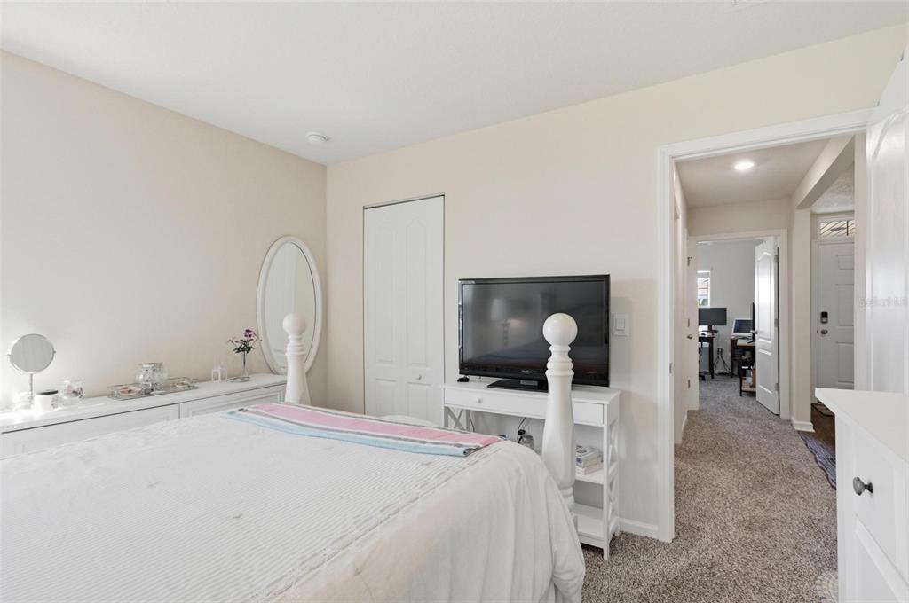 2 Pinnacle Place Bunnell, FL 32110 - Photo 50 of 83 a bedroom with a bed and a mirror